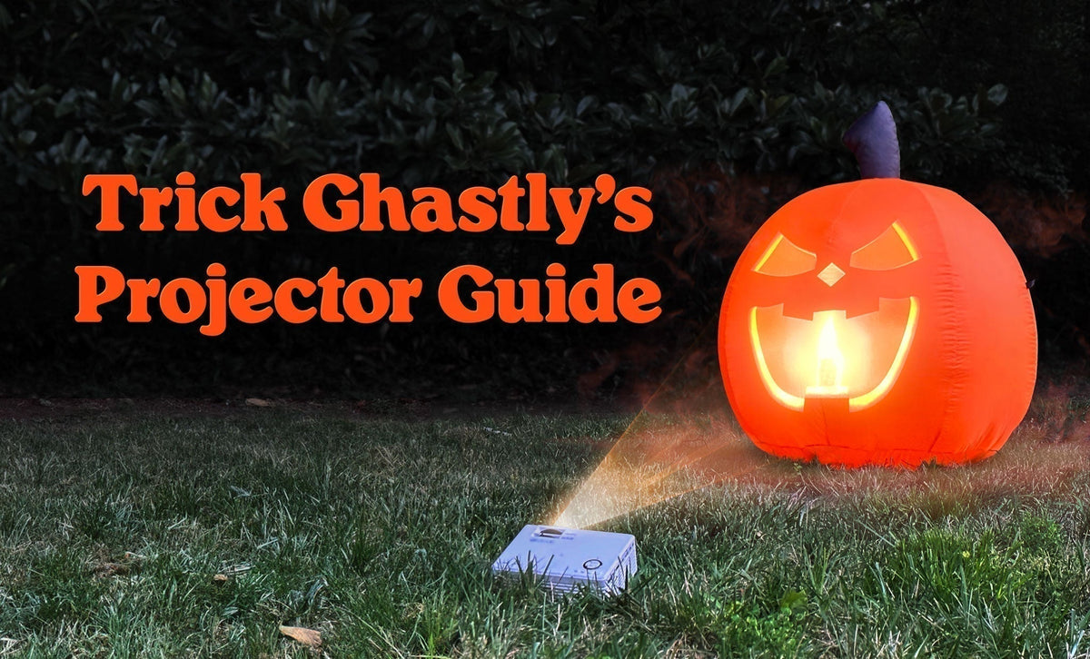 Trick Ghastly's Projector Guide: a projector on the grass lighting up the Trick inflatable